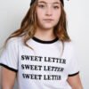 REMERA MEDIANA LETTER